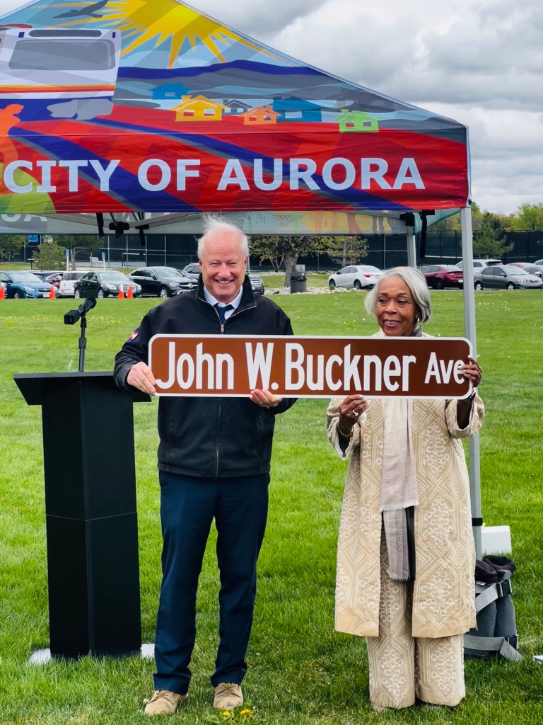 Janet Buckner and Aurora officials celebrate the dedication of John W. Buckner Avenue, recognizing his lifelong commitment to education, public service, and the City of Aurora.
